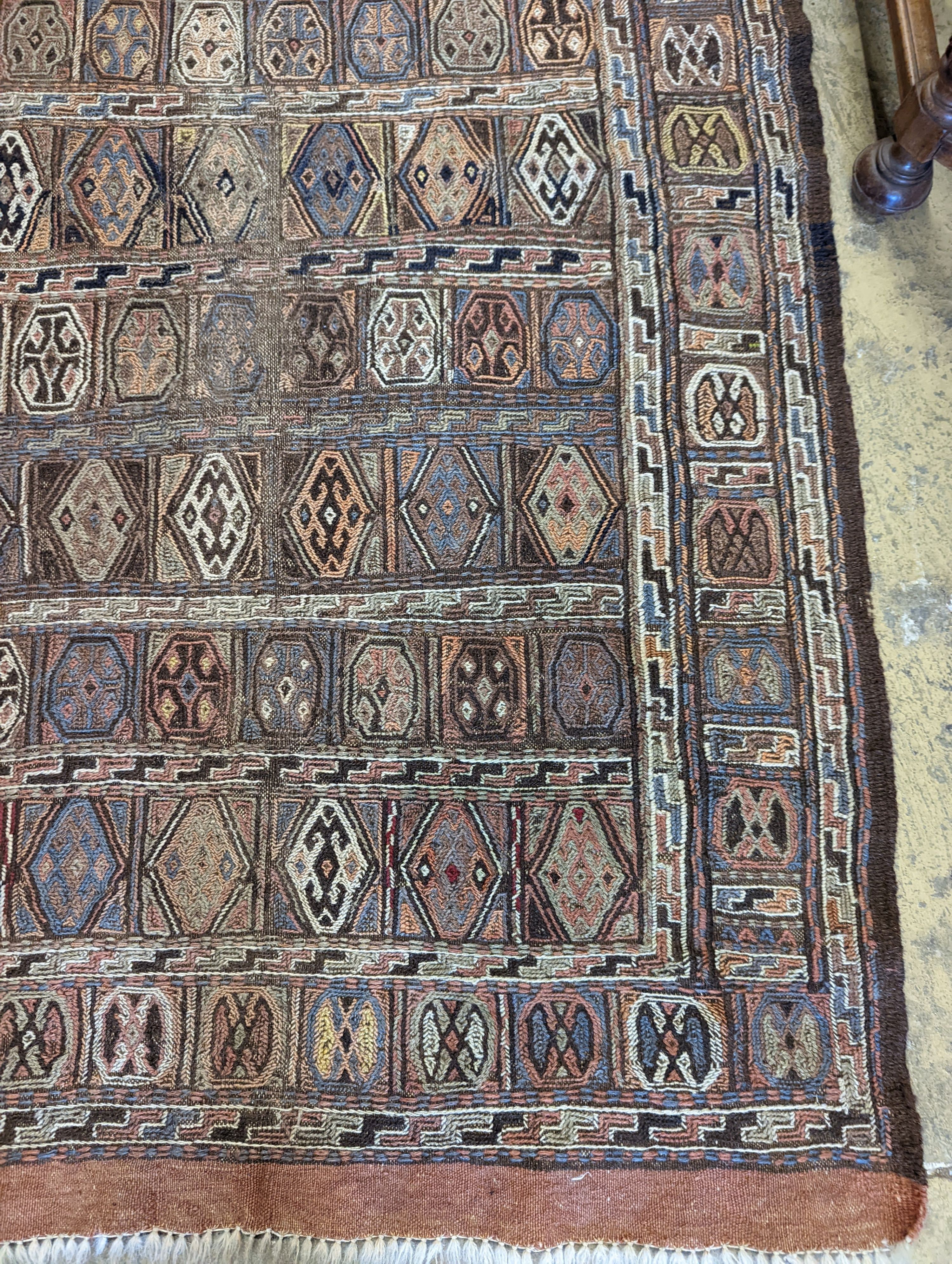 A Sumac flat weave polychrome rug, 180 x 108cm
